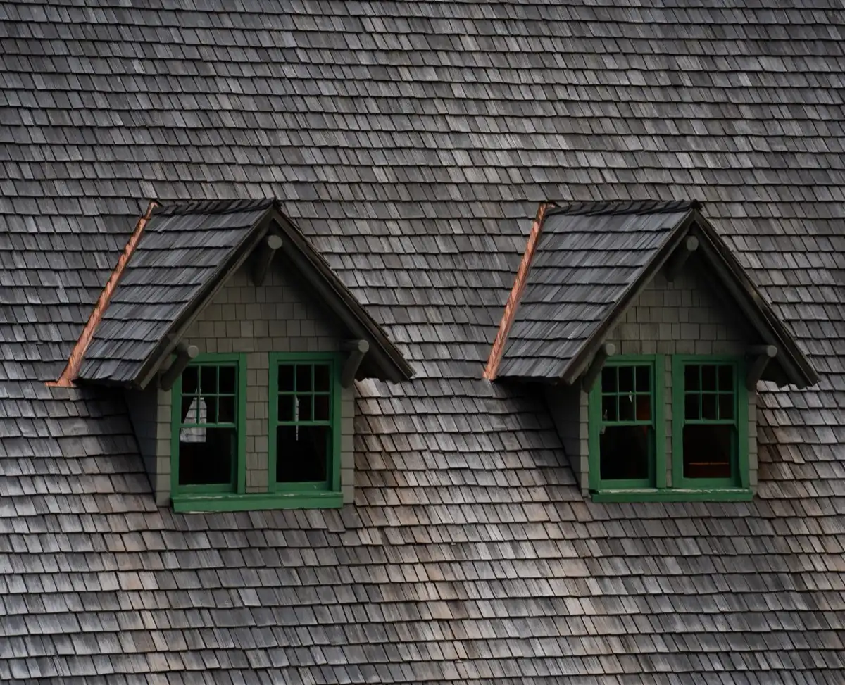 Dormers on a shingle roof in Visalia, CA, where step flashing and kickout flashing carry water past the walls