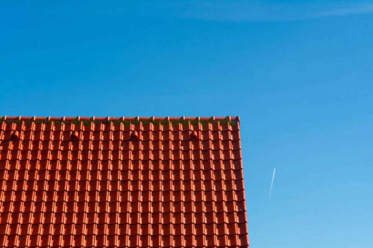 Tile roof gable in full sun, the kind of exposure that sets roof life in Visalia, CA